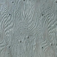 サンドブラスト処理した910mm角のラーチ合板を型枠に用いた壁面